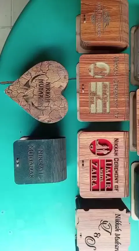 Wooden Bidh Boxes - collection of engraved wooden favor boxes in various finishes